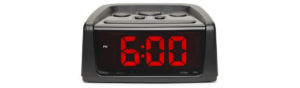 alarm clock showing 6 o'clock
